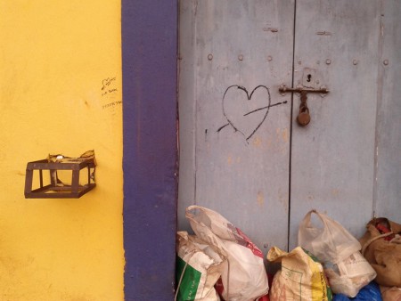 Lilac-coloured doorway with old lock and heart grafitti in Panjim, Goa, India