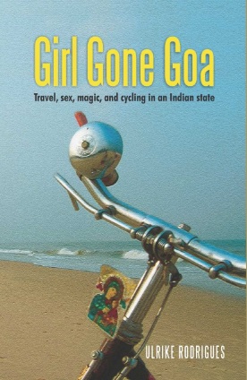 Cover of the Girl Gone Goa book with close-up of bicycle handlebar with Calangute beach in background.